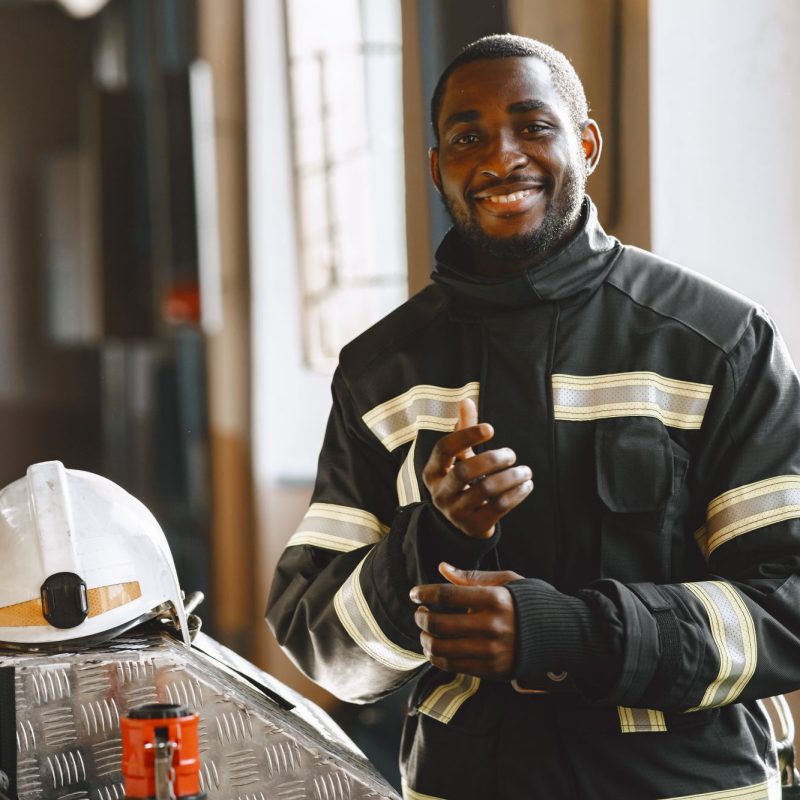 portrait-firefighter-standing-front-fire-engine (1)